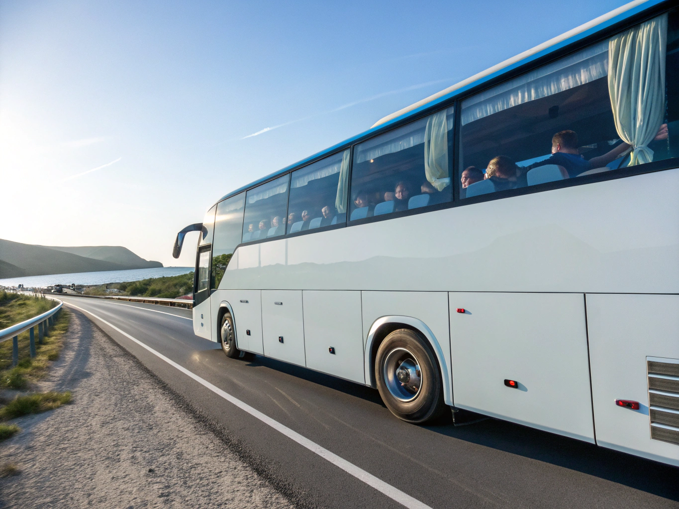Angels Voyages luxury touring bus cruising along scenic Kerala coastal highways, backwaters, and hill stations